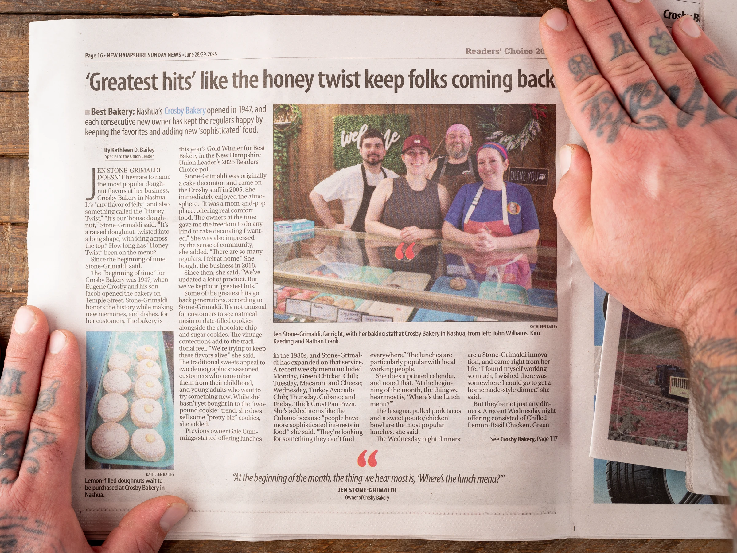 The Union Leader feature about Crosby Bakery, held open to a photograph of our team