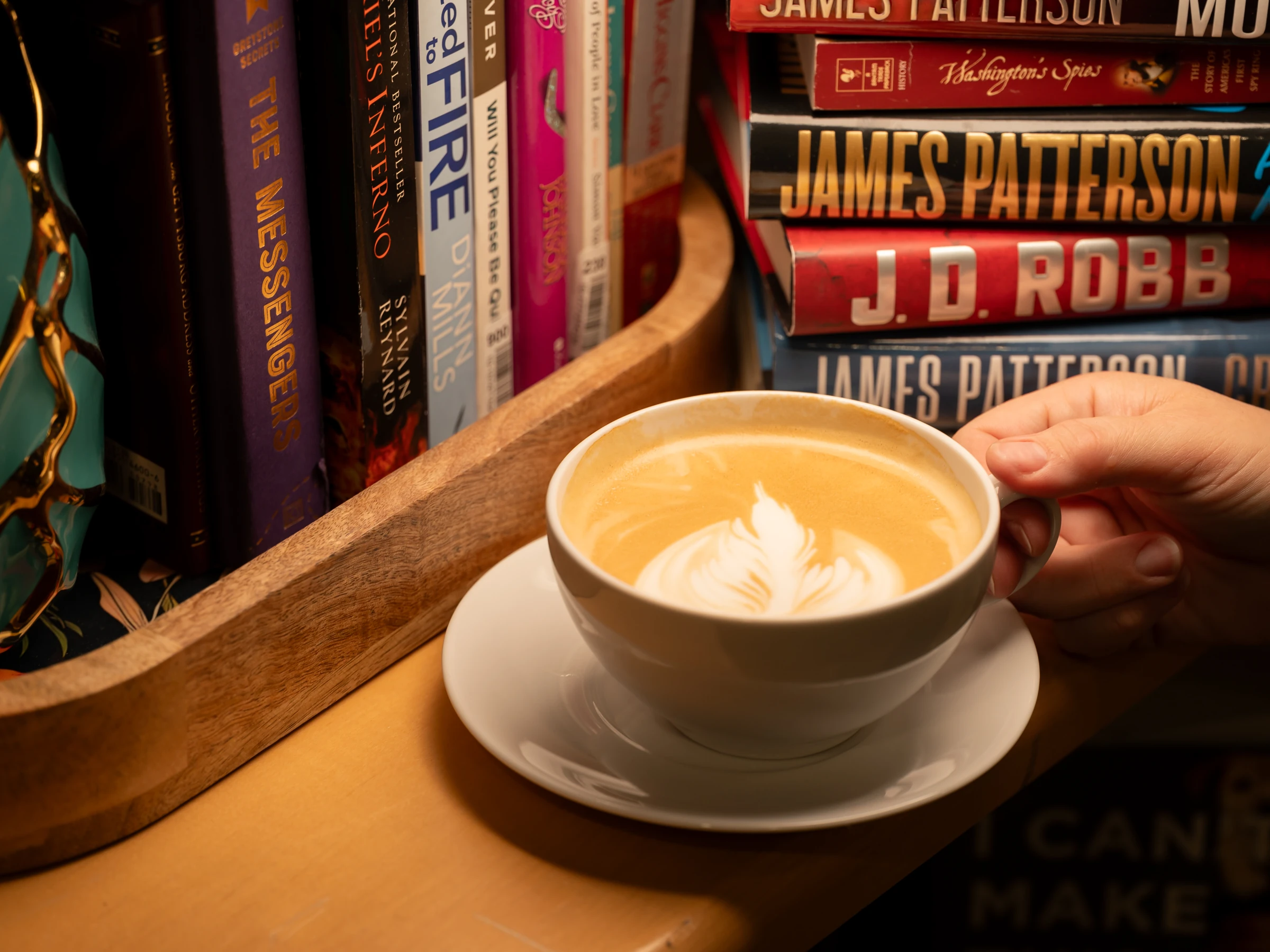 A latte beside the café community library